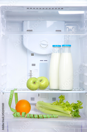 Photo: Open refrigerator with diet food Open refrigerator with diet food