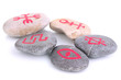 Fortune telling  with symbols on stones isolated on white
