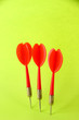 Darts on green background