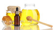 Photo: Fragrant honey spa with oils and honey isolated on white Fragrant honey spa with oils and honey isolated on white