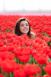 beauty young woman with flowers tulips