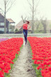 beauty young woman with flowers tulips