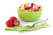 Useful fruit salad of fresh fruits and berries in bowl isolated