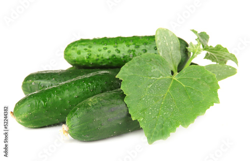 Photo: Tasty green cucumbers, isolated on white Tasty green cucumbers, isolated on white