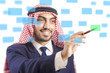Foto: Arab man pressing virtual buttons Arab man pressing virtual buttons