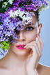 portrait of girl with makeup and flowers around her face