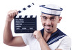 Photo: Sailor with movie clapper on white Sailor with movie clapper on white