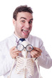 Foto: Funny doctor with skeleton isolated on white Funny doctor with skeleton isolated on white