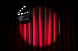 Movie clapper board against curtain
