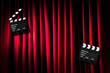 Movie clapper board against curtain