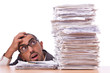 Busy businessman with lots of papers
