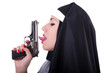 Nun with gun isolated on the white
