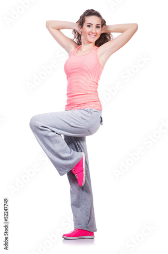 Photo: Young female doing exercises on white Young female doing exercises on white
