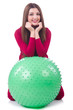 Young woman with ball exercising on white
