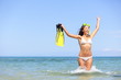 Beach vacation woman excited and happy snorkeling