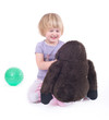 Child playing with monkey doll
