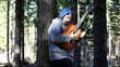 Video: Man playing guitar in the woods leaning against tree/episode 2/ Man playing guitar in the woods leaning against tree/episode 2/