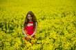 beautyful teenager model in canola field