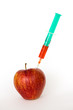 Red apple and syringes isolated on white