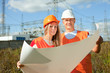 two workers at electric power plant