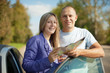 Traveler couple looking at the map