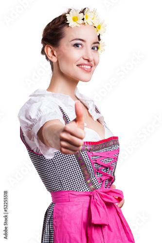 Photo: attraktive junge Frau im Dirndl mit Daumen-Hoch-Geste attraktive junge Frau im Dirndl mit Daumen-Hoch-Geste