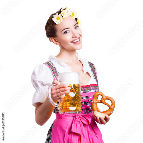 Photo: attraktive junge Frau im Dirndl mit Bierkrug und Brezel attraktive junge Frau im Dirndl mit Bierkrug und Brezel