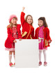 Girls in red are holding white billboard