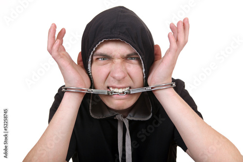 Photo: Man Gnaw a Handcuffs Man Gnaw a Handcuffs