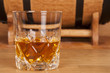 glass of whiskey and barrel