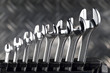 Set of brilliant nut keys of different sizes on support..