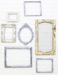 Vintage picture frames on white brick wall background