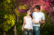Photo: loving couple in a green park. summer loving couple in a green park. summer