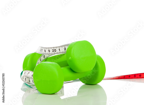Photo: Two green dumbbells on a white background Two green dumbbells on a white background