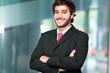 Foto: Handsome businessman in a modern office Handsome businessman in a modern office
