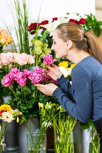 Photo: Female florist in flower shop Female florist in flower shop