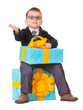 Small boy in spectecles with big present