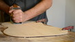 Luthier with Wood  planer  working  in  flamenco  guitar