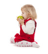Photo: Baby girl eating apple Baby girl eating apple