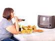Woman eating fast food and watching TV.