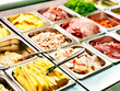 Tray with  food  on showcase at cafeteria