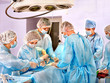 Photo: Surgeon at work in operating room. Surgeon at work in operating room.