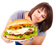 Woman eating hamburger.