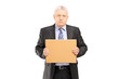 Sad middle aged businessman holding a piece of cardboard and loo