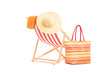 Sun lounger with orange stripes and summer accessories