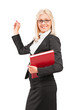 Photo: Young blond teacher holding a book and crayon Young blond teacher holding a book and crayon