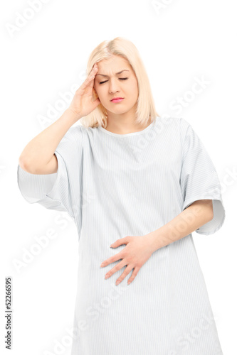 Photo: Young female patient in pain Young female patient in pain