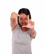 Photo: Asiatic young woman making a frame with her hands Asiatic young woman making a frame with her hands