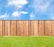 Wooden fence at the grass