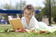 Photo: Portrait of beautiful little girl in spring blossom Portrait of beautiful little girl in spring blossom